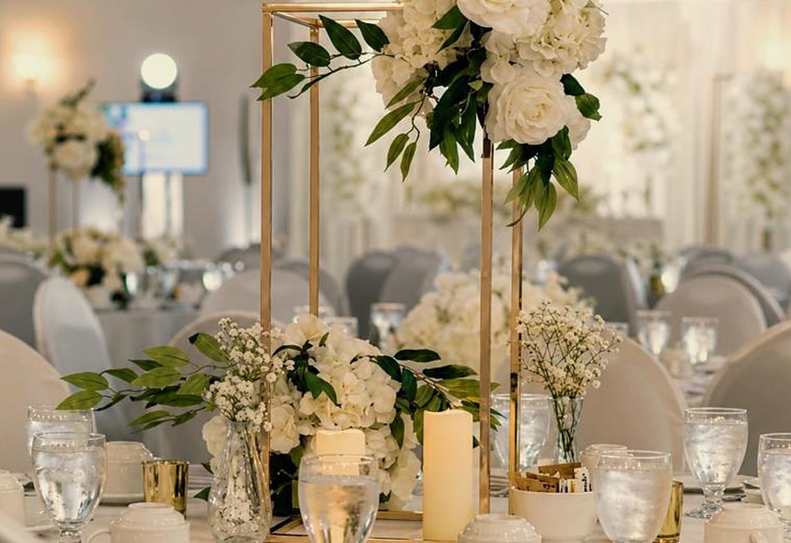 Ballroom tables with gold frame centrepieces